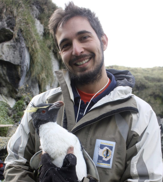 Ralph Vanstreels holding a penguin