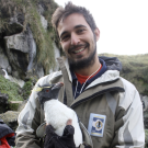 Ralph Vanstreels holding a penguin